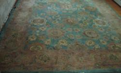 This is a 7.9 x 9.9 wool area rug in great condition. It was placed in a room with little or no foot traffic. Green blue in the middle with mostly tans and cream colors surrounding the outside border. This is a quick sale . I will be moving to Florida.