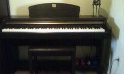 Lightly used electric piano with 4 voices. Padded seat bench included!